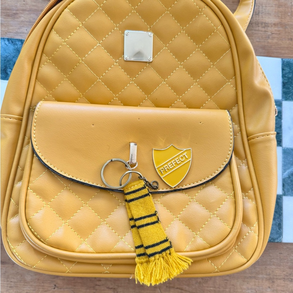 Yellow “Hufflepuff” Quilted Backpack with Prefect Badge & scarf accessories.